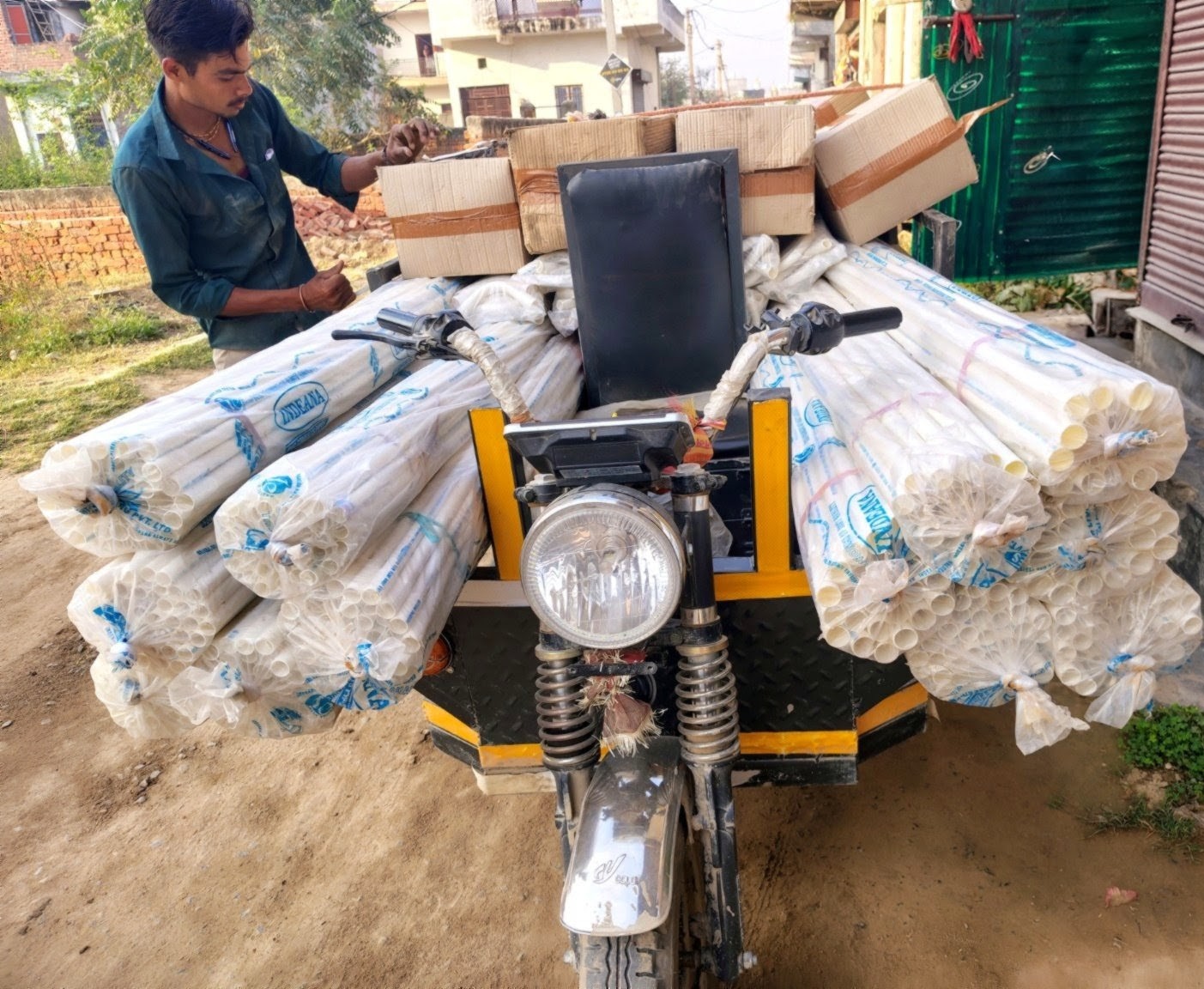 Delivery vehicle loaded with PVC conduit pipes